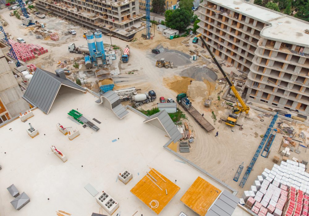 Busy Construction Site and Construction Equipment Aerial top view